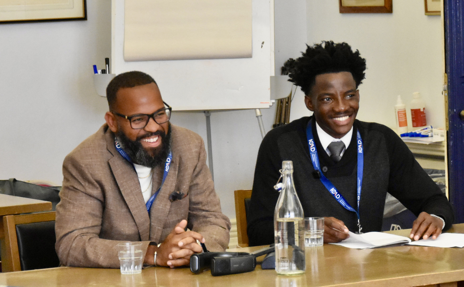 Taikein Cooper (left) and Iyioluwa Adesan (right) co-facilitating The On-Ramp Problem session at ICAD 2026 at the University of Oxford