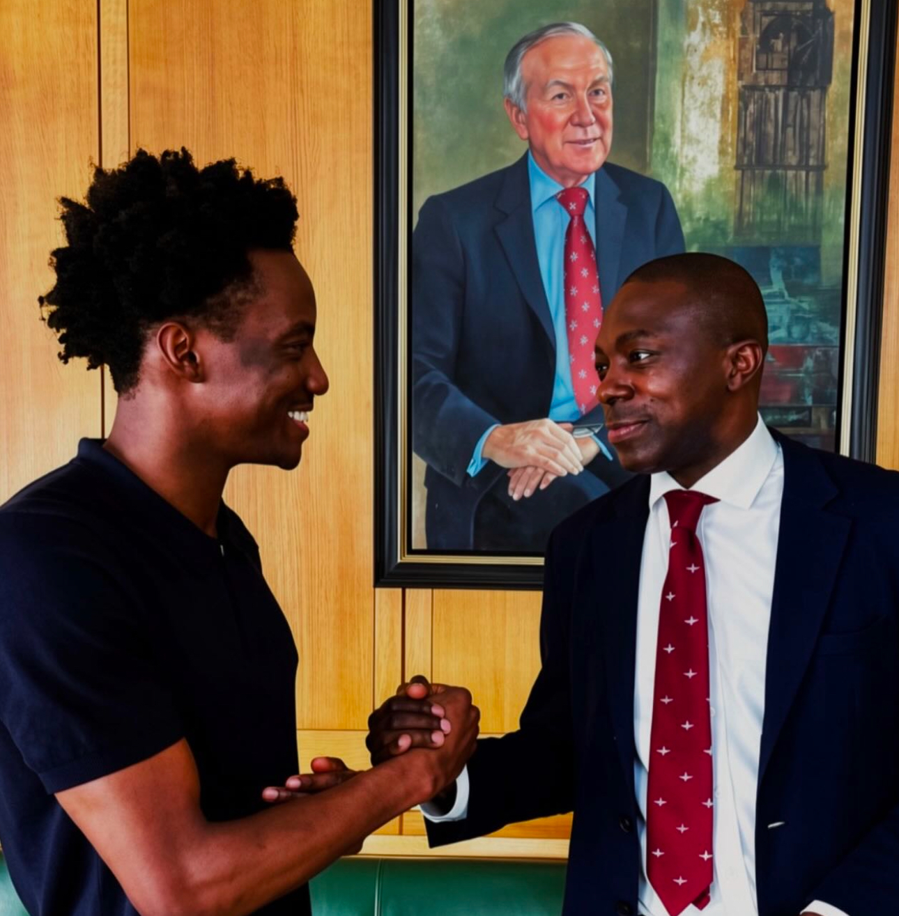 Iyioluwa Adesan shaking hands with Bayo Alaba MP at Portcullis House